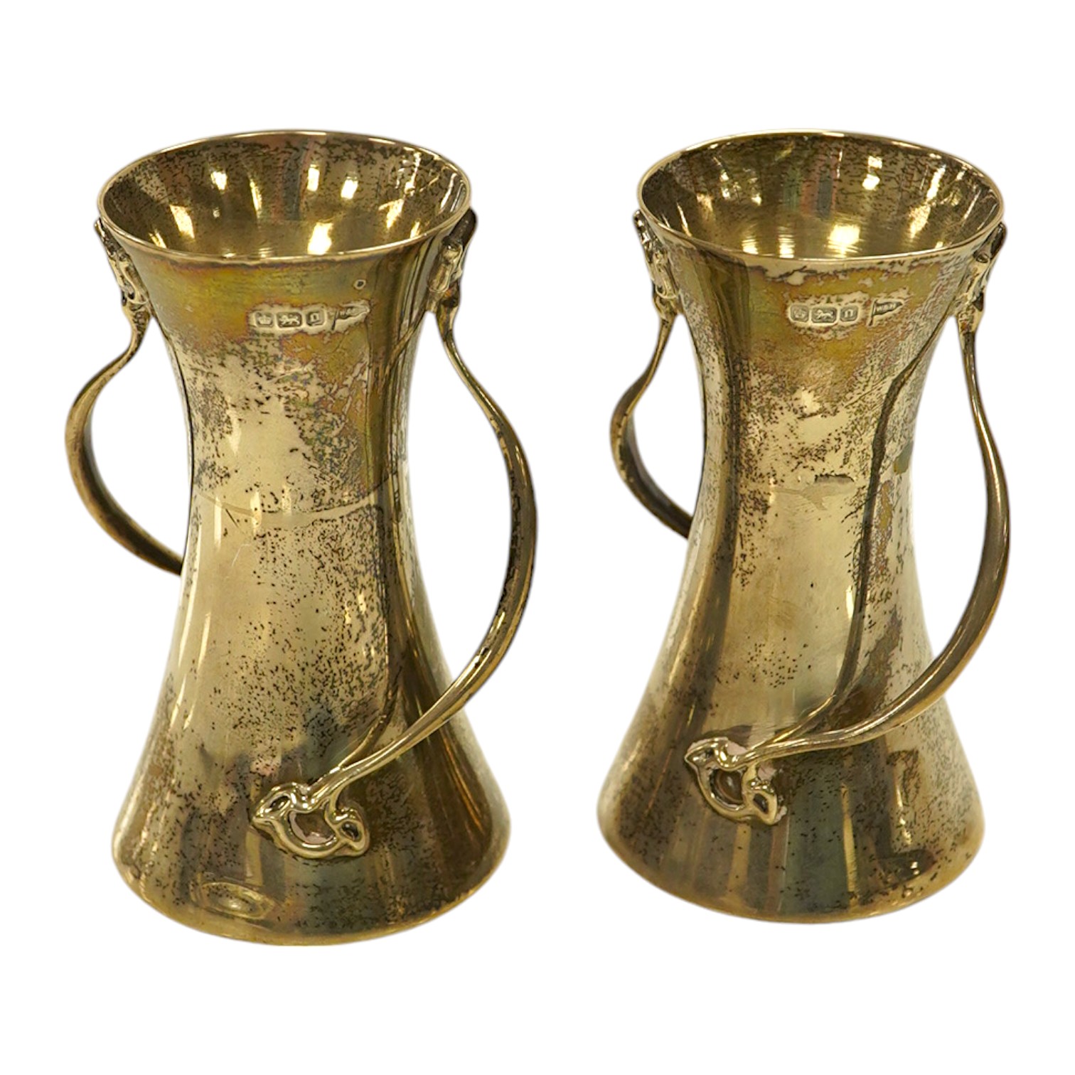 A pair of Edwardian Art Nouveau silver small vases, Walker & Hall, Sheffield, 1906, 10.1cm, 7.4oz. Condition - fair